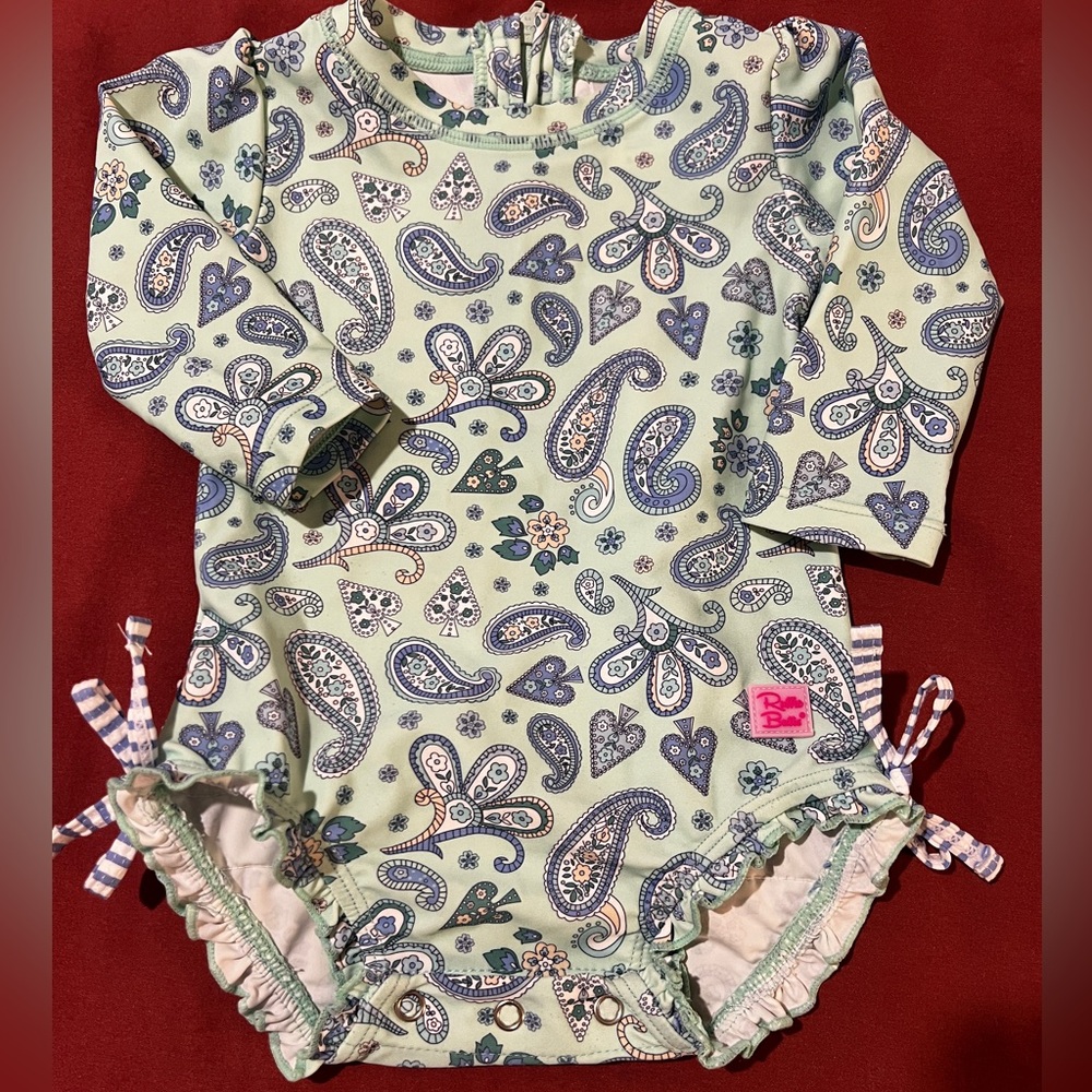 Ruffle butts rash guard swim suit EUC 6-12 months blue paisley